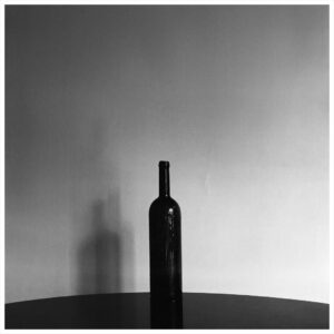 Rahgozar - photograph: a dark bottle and its shadow